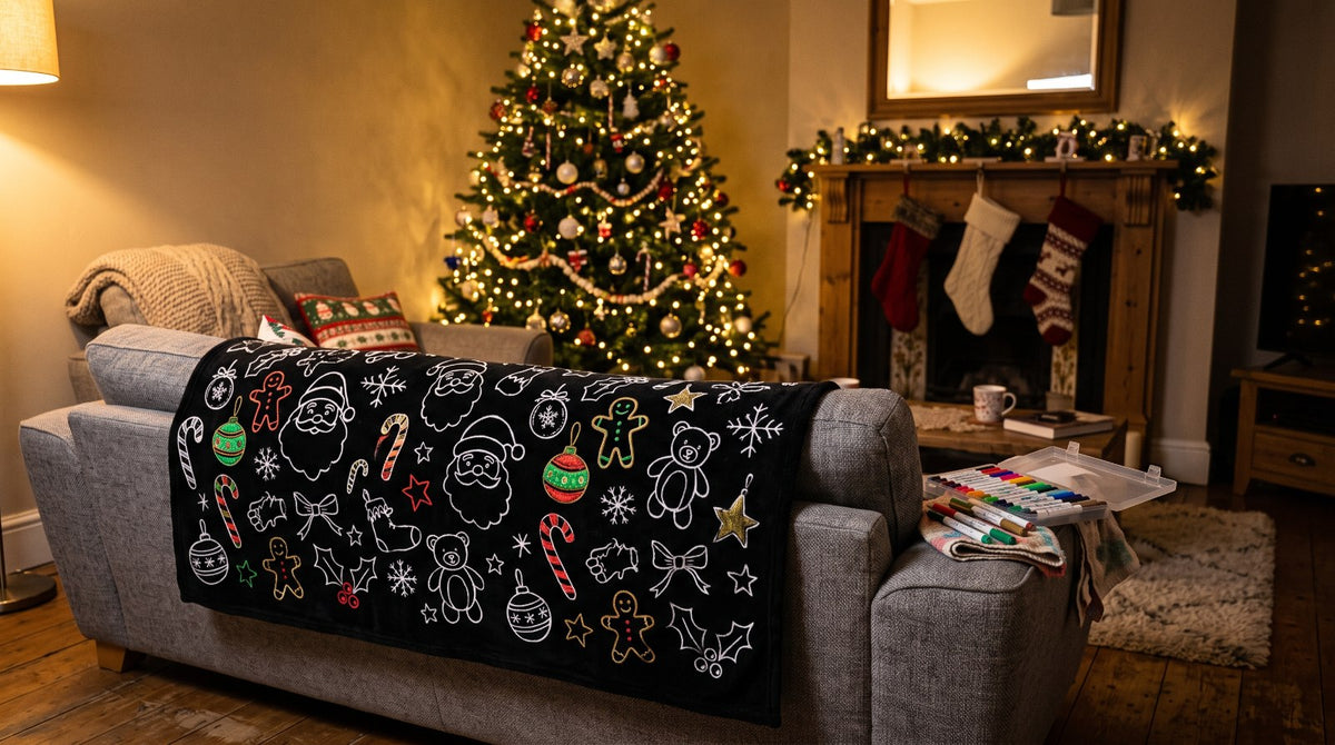 Christmas coloring blanket draped over the couch by the Christmas tree